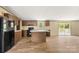 Well-lit kitchen showcases stainless steel appliances, a central island, and wood-style cabinetry at 143 Lakewind Dr, Mooresville, NC 28115