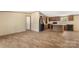 Open-concept living space features the kitchen with sleek black appliances and wood cabinetry at 143 Lakewind Dr, Mooresville, NC 28115