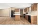 Open-concept kitchen boasts modern appliances, an island, and seamless flow to the living spaces at 143 Lakewind Dr, Mooresville, NC 28115