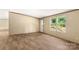Bright living room with wood floors and natural light, creating a warm and inviting atmosphere at 143 Lakewind Dr, Mooresville, NC 28115