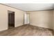 Living room featuring a plank floor and a view into another room at 143 Lakewind Dr, Mooresville, NC 28115