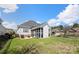 A lovely screened-in porch provides a relaxing outdoor experience overlooking a well-manicured lawn at 1736 Townsend Ln, Rock Hill, SC 29730