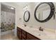 Bathroom features a double sink vanity with decorative framed mirrors and tile flooring at 1736 Townsend Ln, Rock Hill, SC 29730