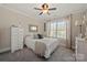 Cozy bedroom with soft carpet, a ceiling fan, and a window offering natural light at 1736 Townsend Ln, Rock Hill, SC 29730