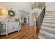 Grand foyer with hardwood floors, staircase with iron railings, and open view to a coffered ceiling room at 1736 Townsend Ln, Rock Hill, SC 29730