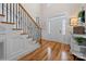 Elegant foyer featuring hardwood floors, a staircase with wrought iron details, and a bright, welcoming atmosphere at 1736 Townsend Ln, Rock Hill, SC 29730