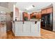 Kitchen counter with cherry cabinets and black appliances with hardwood floors at 1736 Townsend Ln, Rock Hill, SC 29730