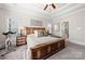 The main bedroom features a tray ceiling, a ceiling fan and an ensuite bathroom at 1736 Townsend Ln, Rock Hill, SC 29730