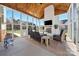 Relaxing sunroom with wood ceiling, fireplace, and serene views of the backyard at 1736 Townsend Ln, Rock Hill, SC 29730