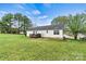 A well-manicured lawn surrounds the house, complemented by a charming deck ideal for outdoor relaxation at 301 N 4Th Ave, Maiden, NC 28650