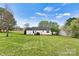 Expansive backyard featuring a well-maintained lawn and a cozy deck attached to the home at 301 N 4Th Ave, Maiden, NC 28650