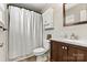 Cozy bathroom featuring a shower and tub, vanity, and toilet at 301 N 4Th Ave, Maiden, NC 28650