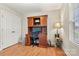 Cozy office featuring vinyl floors, a ceiling fan, and a large window, creating a comfortable space at 301 N 4Th Ave, Maiden, NC 28650