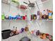 Organized pantry with white wire shelving holding various food items and household supplies at 301 N 4Th Ave, Maiden, NC 28650