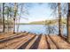 Picturesque view of the tranquil lake framed by trees in a scenic natural setting at 6066 Jepson Ct, Charlotte, NC 28214