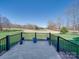 Outdoor patio area overlooking a well-manicured green lawn at 810 Lake Wright Rd, China Grove, NC 28023