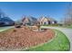 Beautiful home with a water fountain feature and circular driveway at 810 Lake Wright Rd, China Grove, NC 28023