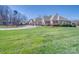 Beautiful brick home featuring a circular driveway, fountain, and meticulously maintained landscaping at 810 Lake Wright Rd, China Grove, NC 28023