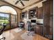 Cozy home office featuring built-in shelving, hardwood floors, and large windows at 810 Lake Wright Rd, China Grove, NC 28023