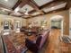 Inviting living room featuring coffered ceilings, hardwood floors, and a large, colorful area rug at 810 Lake Wright Rd, China Grove, NC 28023