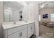 Bright bathroom features double vanity sinks with shower and views to the bedroom at 9706 Tea Garden Dr, Gastonia, NC 28056