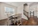 Dining area featuring a table, seating, staircase, and view of the kitchen at 9706 Tea Garden Dr, Gastonia, NC 28056