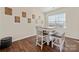 Dining room with a square table, seating for four, and natural light at 9706 Tea Garden Dr, Gastonia, NC 28056