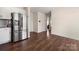 Spacious kitchen and dining area featuring hardwood floors, stainless steel appliances, and lots of natural light at 9706 Tea Garden Dr, Gastonia, NC 28056