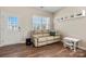 Cozy living room with hardwood floors, a comfortable couch, and a bright window, perfect for Gathering time at 9706 Tea Garden Dr, Gastonia, NC 28056