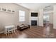 Open living area with wood floors, fireplace and large windows providing natural light at 9706 Tea Garden Dr, Gastonia, NC 28056