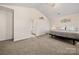 Main bedroom featuring carpet, a large bed, and an ensuite bathroom entrance at 9706 Tea Garden Dr, Gastonia, NC 28056