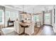 Bright dining room with hardwood floors, modern light fixtures, and an open-concept kitchen at 1028 Seven Sisters Ave, Monroe, NC 28110