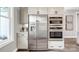 Elegant kitchen area showcasing stainless steel appliances, custom cabinetry, and sleek countertops at 1028 Seven Sisters Ave, Monroe, NC 28110