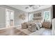 Serene main bedroom featuring a coffered ceiling, two sitting chairs, and hardwood flooring at 1028 Seven Sisters Ave, Monroe, NC 28110