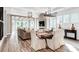 Open-concept living space with dining area, living room, and modern finishes, perfect for entertaining at 1028 Seven Sisters Ave, Monroe, NC 28110