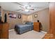 Bedroom featuring ceiling fan, bed with gray bedding, and dresser at 111 Cedar Dr, Salisbury, NC 28147