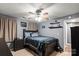 Bedroom featuring ceiling fan, bed with gray bedding, and nightstand at 111 Cedar Dr, Salisbury, NC 28147