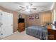 Bedroom featuring ceiling fan, bed with gray bedding, and dresser at 111 Cedar Dr, Salisbury, NC 28147