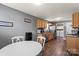 Spacious kitchen featuring stainless steel appliances, wooden cabinets, and a cozy dining area at 111 Cedar Dr, Salisbury, NC 28147