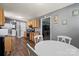 Open kitchen with wood cabinets, modern appliances, and an adjacent dining area and living room at 111 Cedar Dr, Salisbury, NC 28147