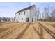 A spacious backyard with ample natural light, showcasing the home's back exterior and backyard at 113 Homewood Ln, Statesville, NC 28625