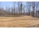 A lush lot filled with mature trees is ready for your imagination and creativity to make it your own at 113 Homewood Ln, Statesville, NC 28625