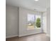 Bedroom with view of a neighborhood in the distance, wood floors, and natural light at 113 Homewood Ln, Statesville, NC 28625