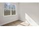 Bedroom with wood floors, natural light, and a view of the trees at 113 Homewood Ln, Statesville, NC 28625