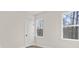 Bedroom with wood floors, white door, window, and natural light at 113 Homewood Ln, Statesville, NC 28625