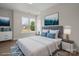 Airy bedroom boasts a plush bed, modern furnishings, and large windows for natural light at 113 Homewood Ln, Statesville, NC 28625