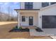 Welcoming front porch with well-manicured landscaping, enhancing curb appeal, and includes a two-car garage at 113 Homewood Ln, Statesville, NC 28625