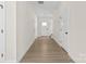 Hallway with wood-look flooring leading to the front door and other rooms at 113 Homewood Ln, Statesville, NC 28625