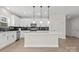 A new kitchen featuring an island with quartz countertops, stainless appliances, and black subway tile backsplash at 113 Homewood Ln, Statesville, NC 28625