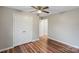 Bedroom featuring hardwood floors, a ceiling fan, and a double door closet at 118 Alfara Ln, Troutman, NC 28166